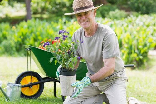 Professional gardeners in Chingford working safely on site